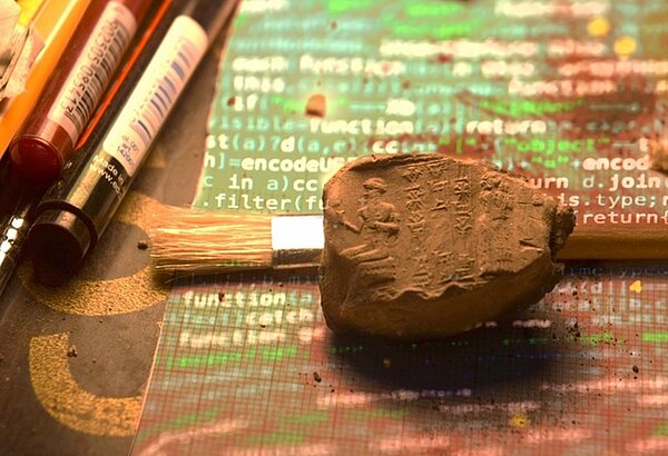 Sealing on a digital printout (big) Ancient West Asian clay sealing with cuneiform on printed programming code – representing the KIŠIB digital corpus project.